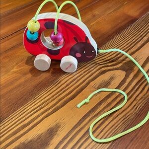Janod | Red wooden Pull-Along Toy with Beads